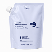Kezy Blue Bleaching Powder 500g in a Light Blue refill pouch with a screw-cap spout, formulated to lift hair up to nine levels, displayed against a soft white background.
