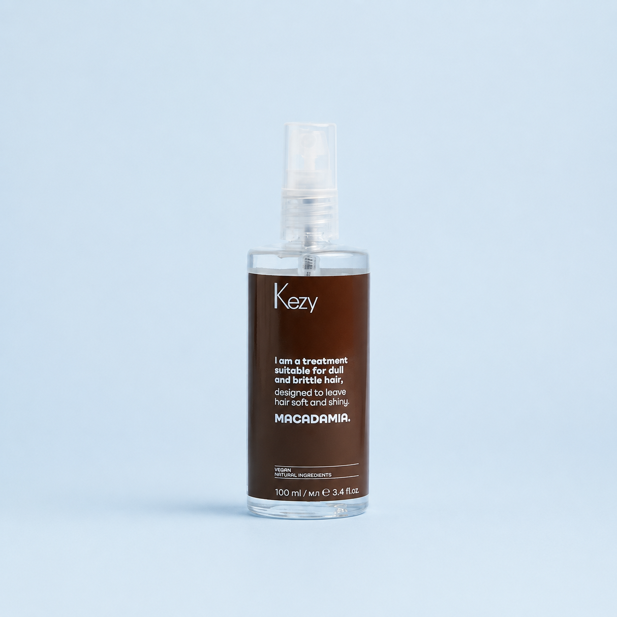 Kezy Macadamia Treatment Oil 100ml bottle on a light blue background