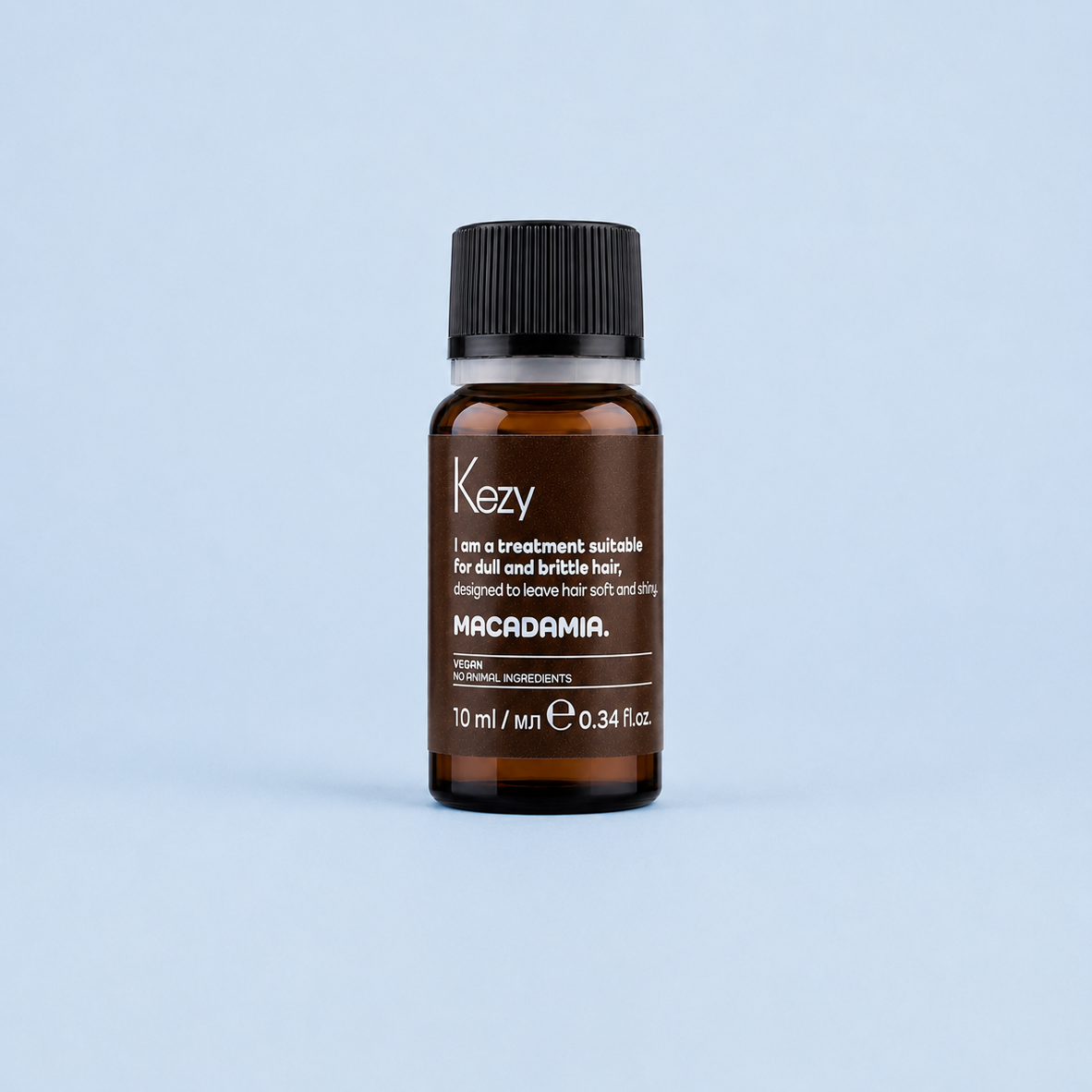 Kezy Macadamia Treatment Oil 10ml glass bottle on a light blue background