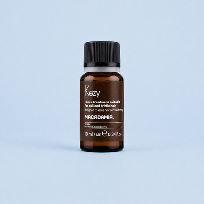 Kezy Macadamia Treatment Oil 10ml glass bottle on a light blue background