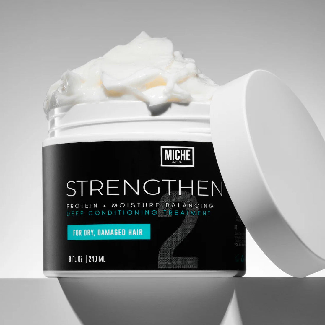 Miche hair treatment strengthen jar with white cream on a gray background