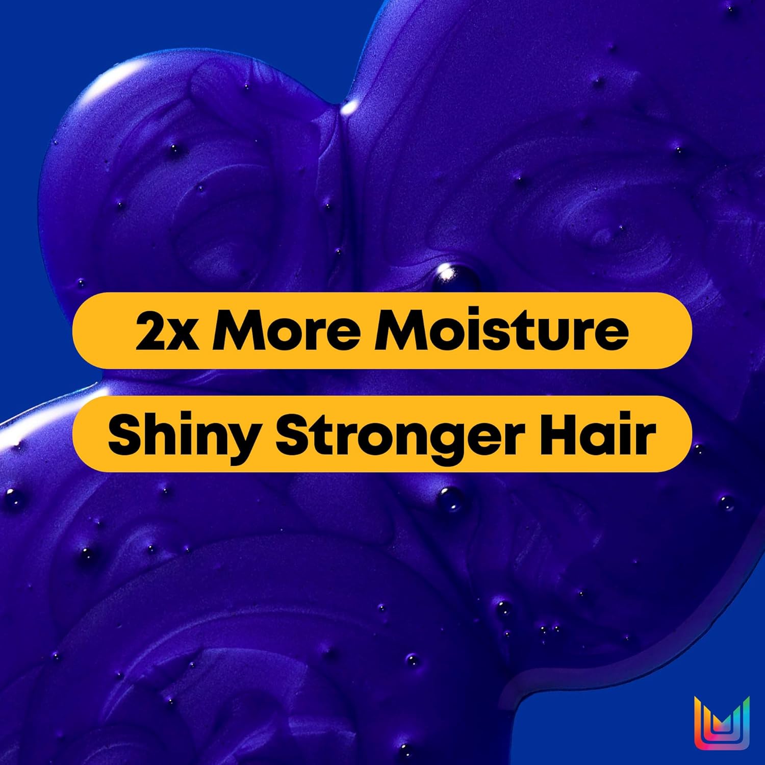 Close-up of rich blue-purple Matrix Brass Off Shampoo texture with text highlighting twice the moisture and shinier, stronger-looking hair