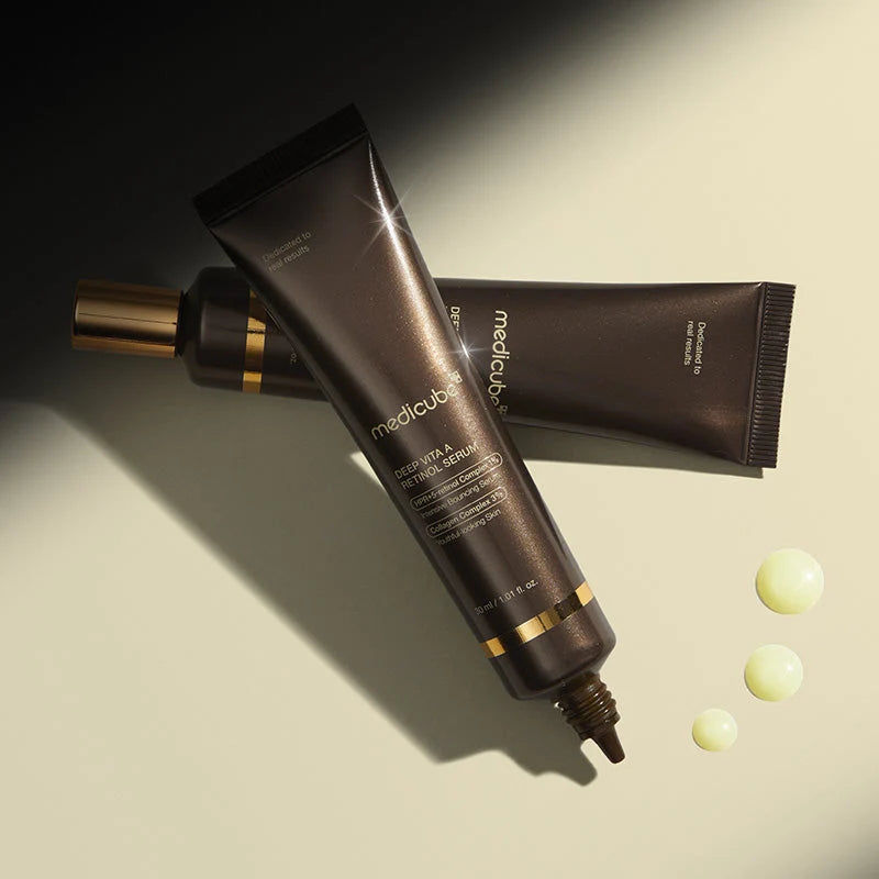 MediCube skincare serum tube with applicator on a beige background