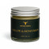 Jar of tallow and honey balm with &