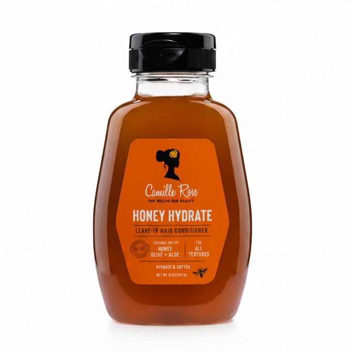 Bottle of Camille Rose Honey Hydrate Leave-In Hair Conditioner on a white background