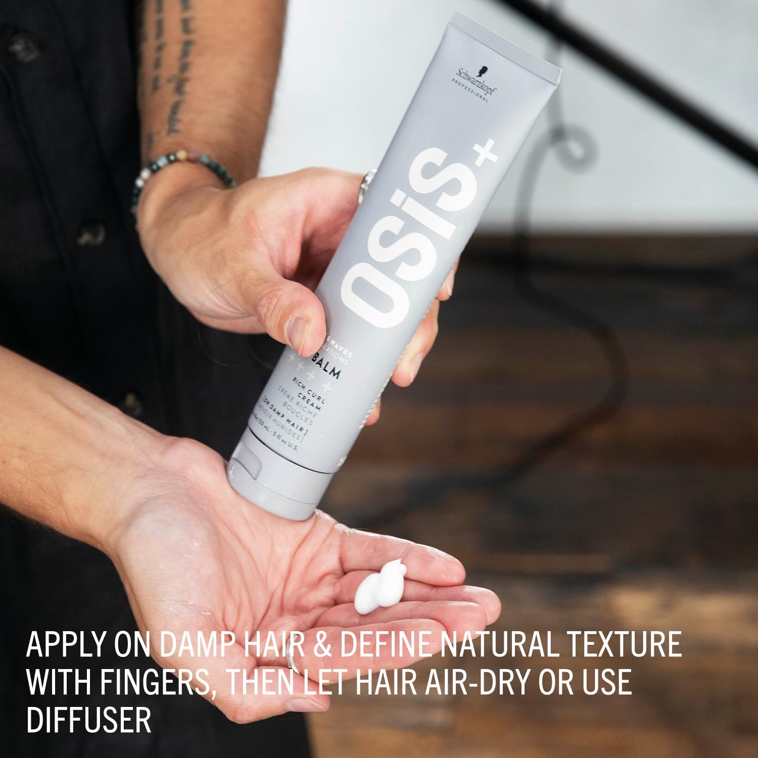 Schwarzkopf Professional OSiS Bounty Balm 150ml being dispensed into a hand for application to damp curly or wavy hair