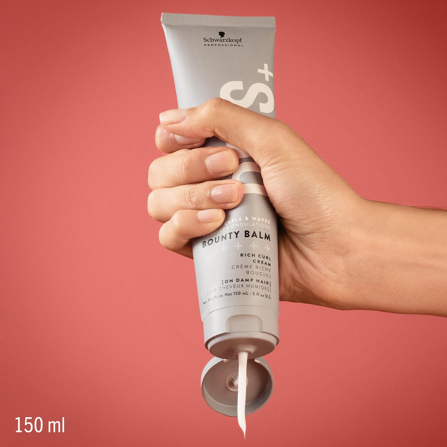 Hand dispensing Schwarzkopf Professional OSiS Bounty Balm 150ml rich curl cream from an open grey tube