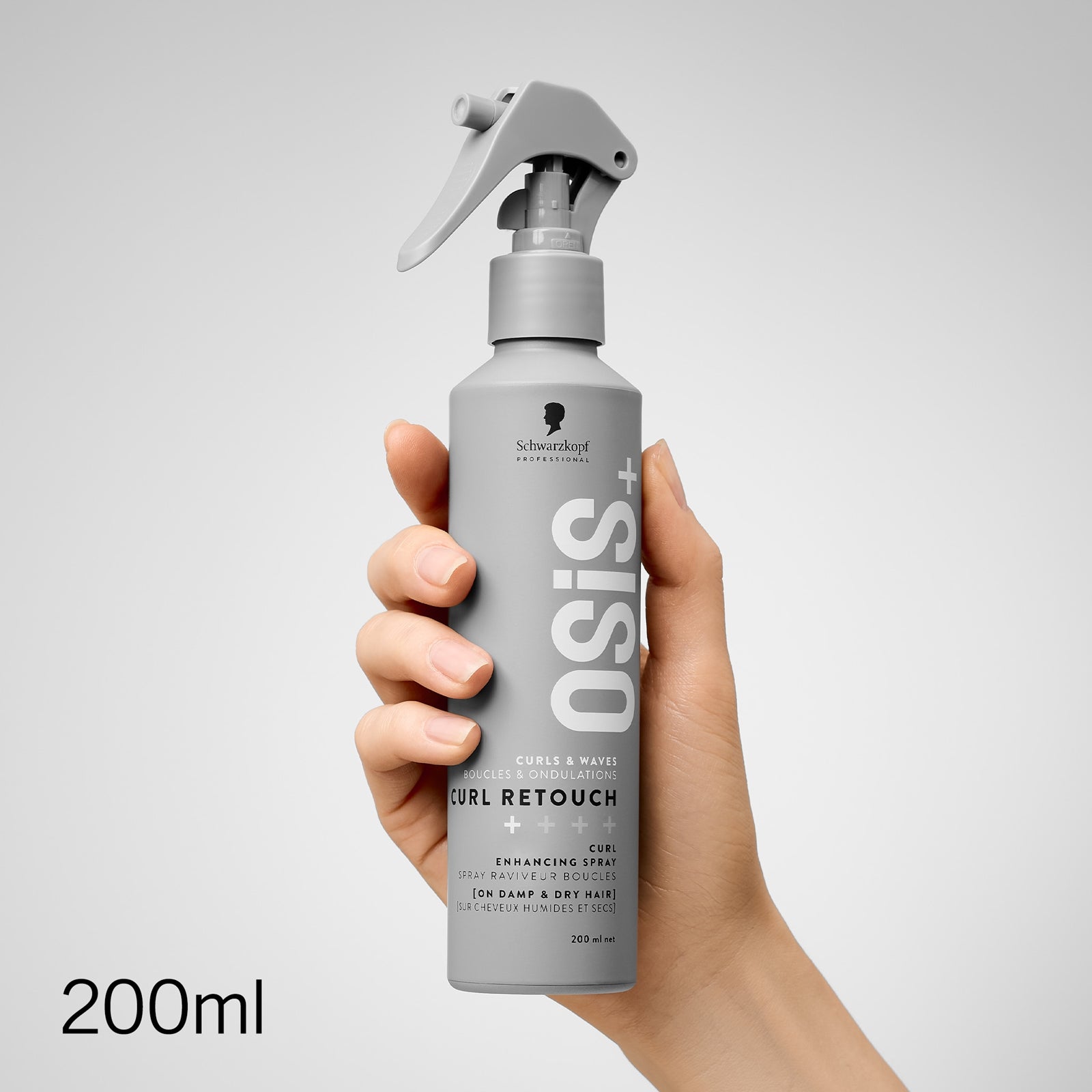 hand holding Schwarzkopf Professional Osis Curl Retouch Curl Enhancing Spray 200ml