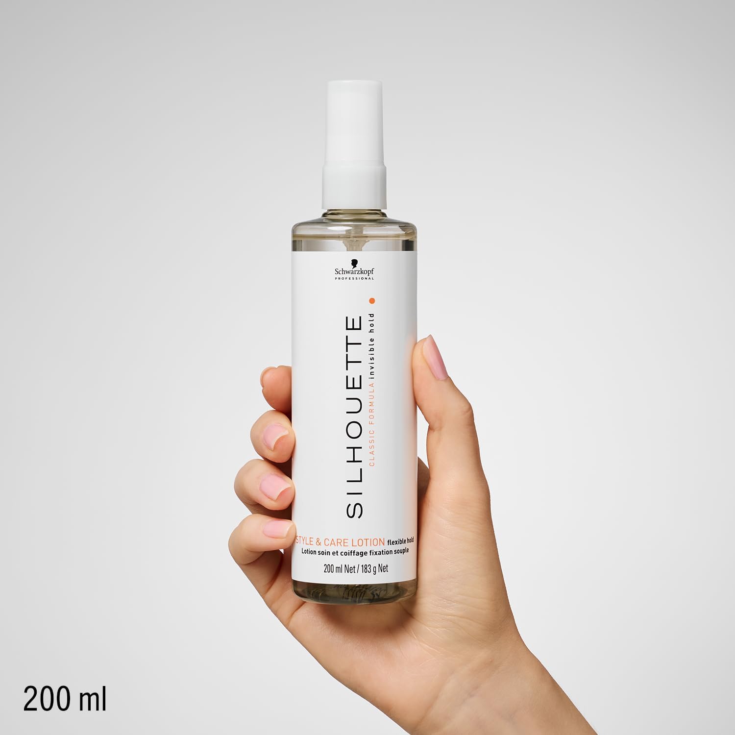 Hand holding Schwarzkopf Professional Silhouette Style & Care Lotion Flexible Hold 200ml