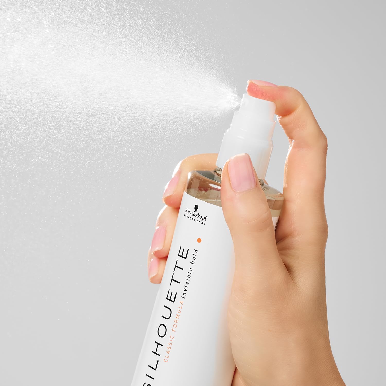 Hand spraying Schwarzkopf Professional Silhouette Style & Care Lotion Flexible Hold 200ml