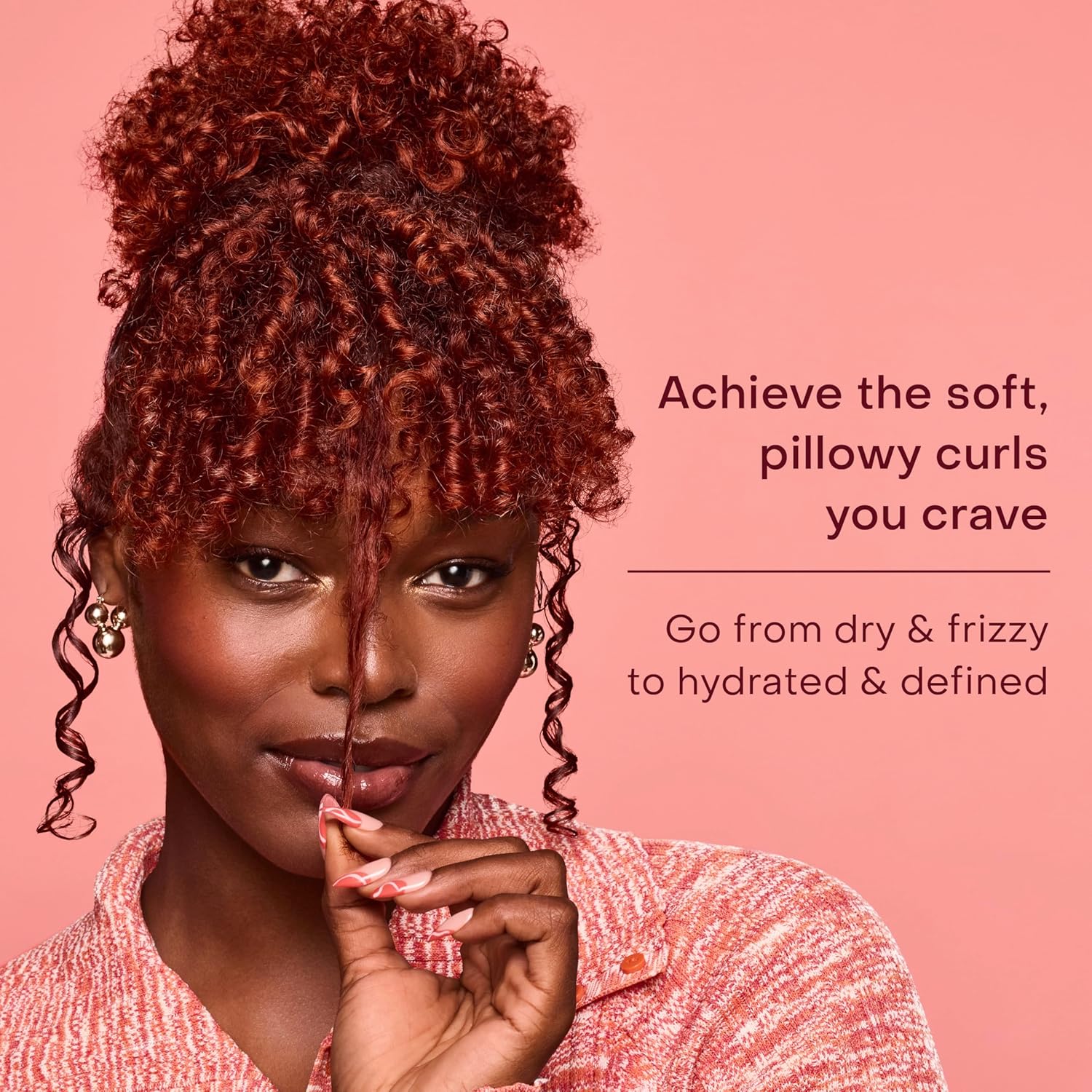 Woman with soft, hydrated and defined red curls styled using SheaMoisture Coconut & Hibiscus + Flaxseed Define & Shine Styling Gel for frizz control