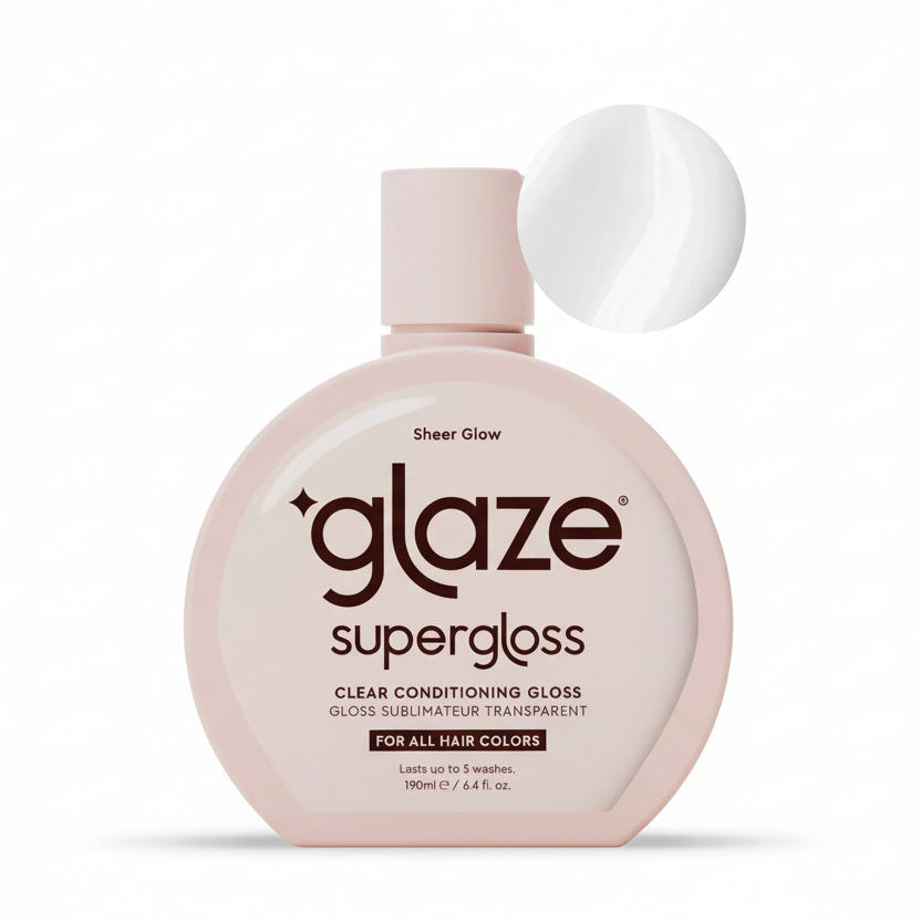 Superglaze clear conditioning gloss bottle on a light pink background