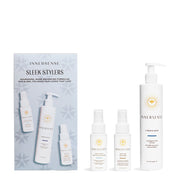 The image displays the Innersense Holiday Kit - Sleek Stylers 3pc, which includes a set of hair care products. The products are arranged in front of a packaging that features a white background with decorative elements.