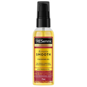 TRESemmé Keratin Smooth Finishing Oil 75ml with marula oil for frizz control and glossy, smooth hair in a clear pump bottle, visible golden colour oil on a white background