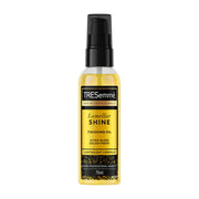 TRESemmé Lamellar Shine Finishing Oil 75ml in a clear golden bottle with black pump and gold label, centred on a clean white background