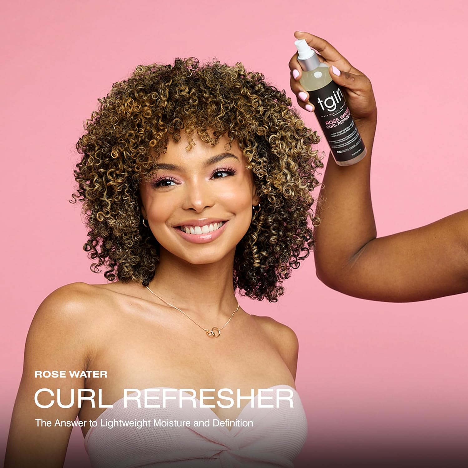 Tgin Rose Water Curl Refresher 8oz with a model and hand holding product spraying the hair 