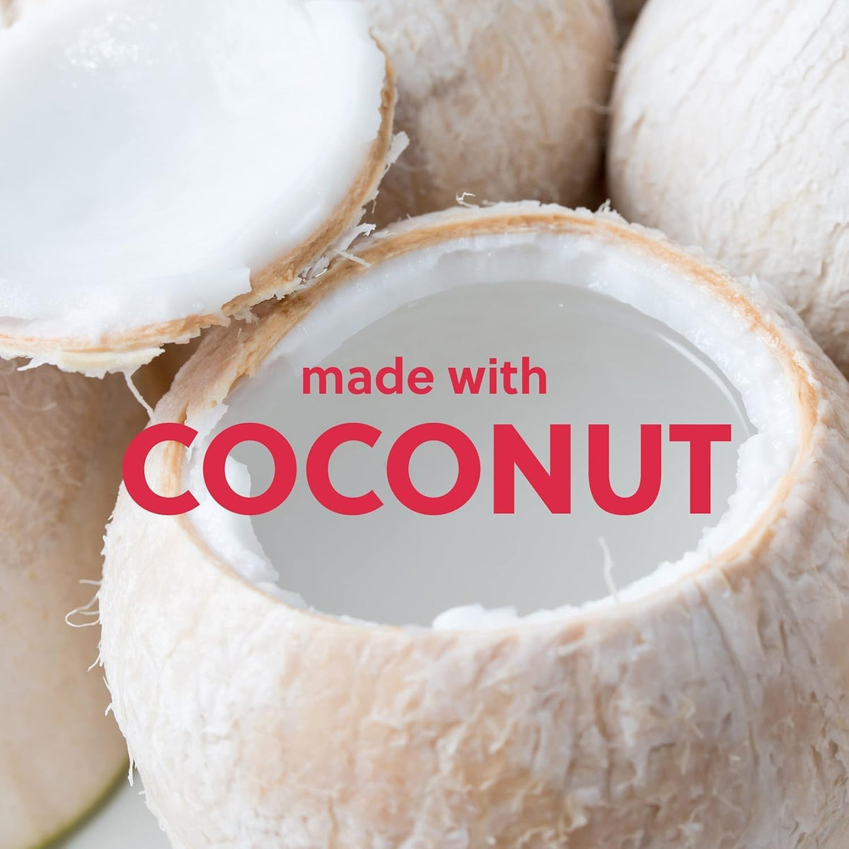 a picture of a coconut with the top sliced opened showcasing the coconut ingredient used in Tree Hut Coco Colada Shea Sugar Scrub 18oz