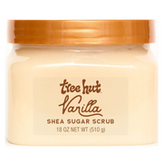 front view of Tree Hut Vanilla Shea Sugar Scrub 18oz in the newest packaging, a clear tub with an orange lid against a clean white background
