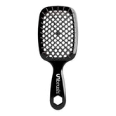 Black unbrush hairbrush with a honeycomb design on a white background