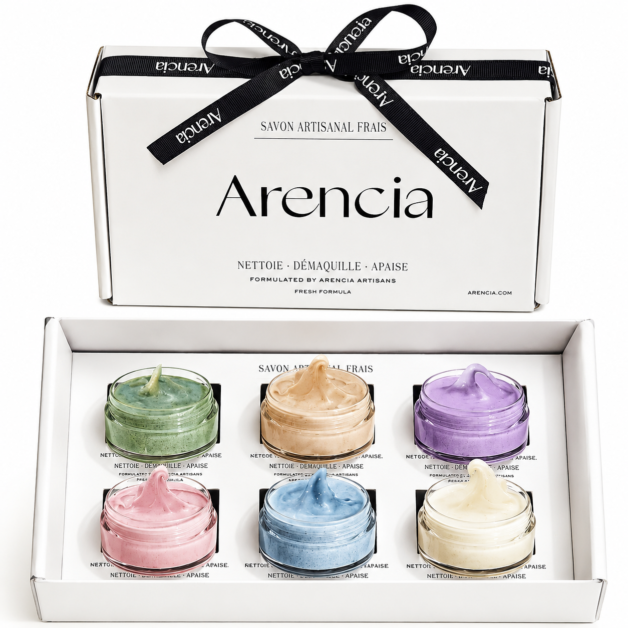 arencia fresh cleanser discovery set featuring six mini whipped facial cleansers in pastel shades, presented in an open white gift box with a black ribbon on a white background.