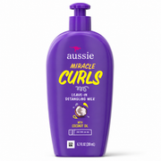 aussie miracle curls leave-in detangling milk 200ml in a purple squeezy bottle, enriched with coconut oil to help detangle knots, reduce frizz, and leave curls soft, smooth, and hydrated. displayed on a clean white background.