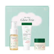 axis-y the mini glow trio skincare gift set featuring travel-size dark spot correcting glow toner, glow serum and glow cream in front of a pastel green gift box. brightening skincare set formulated with niacinamide, squalane and sea buckthorn fruit extract to hydrate skin and help improve the appearance of dark spots and uneven skin tone.