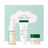 axis-y the mini glow trio skincare gift set featuring travel-size dark spot correcting glow toner, glow serum and glow cream in front of a pastel green gift box. brightening skincare set formulated with niacinamide, squalane and sea buckthorn fruit extract to hydrate skin and help improve the appearance of dark spots and uneven skin tone.