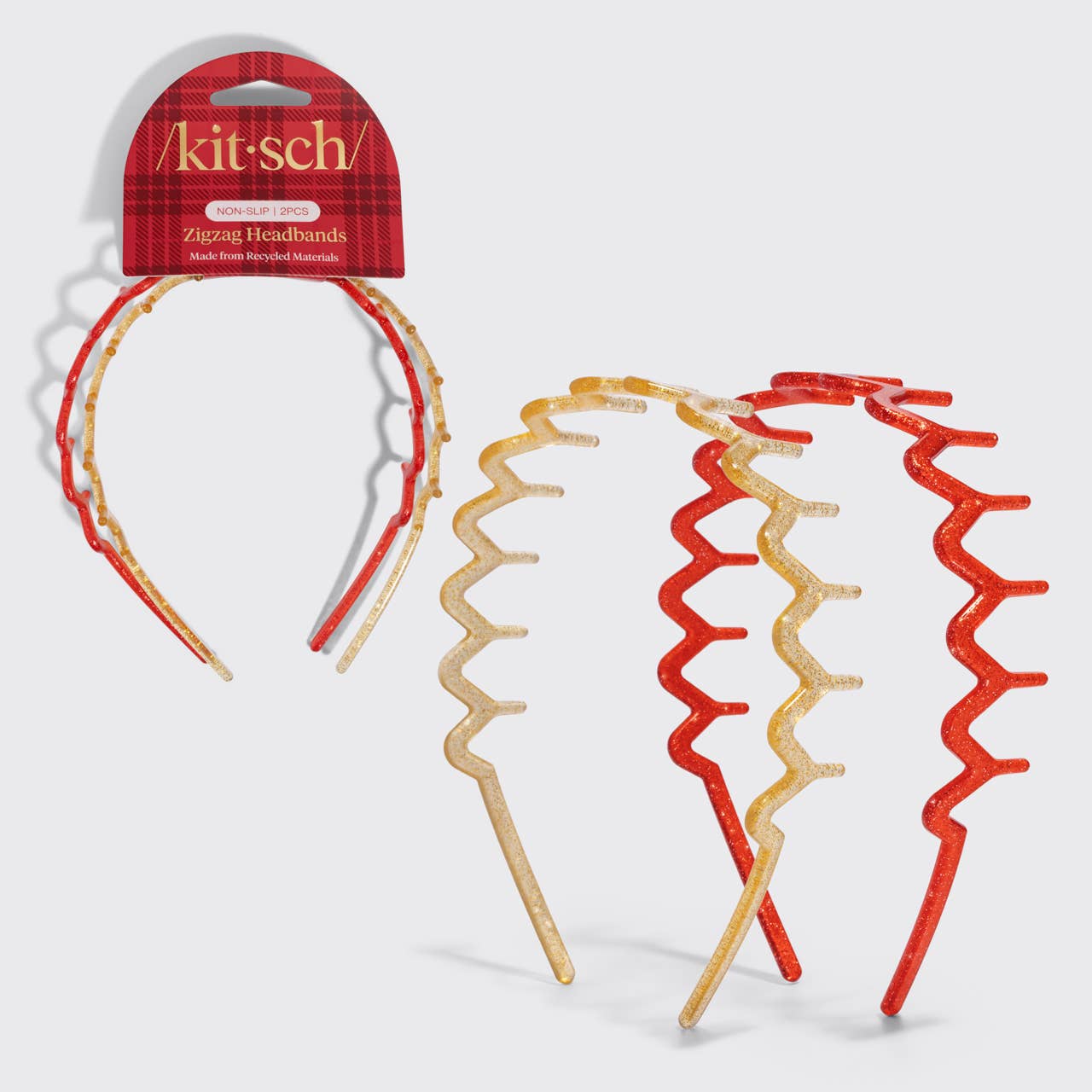 Three Kitsch Zluzag headbands with a red and gold plaid pattern, shown both on their retail packaging and as a set of three on a light gray background.