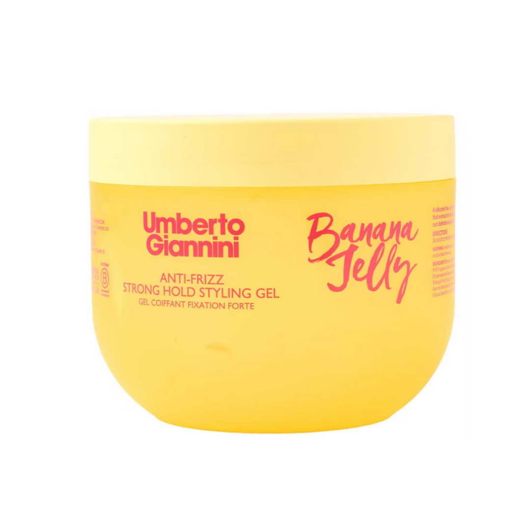 Yellow jar of Umberto Giannini Banana Jelly styling gel on a white background