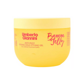 Yellow jar of Umberto Giannini Banana Jelly styling gel on a white background