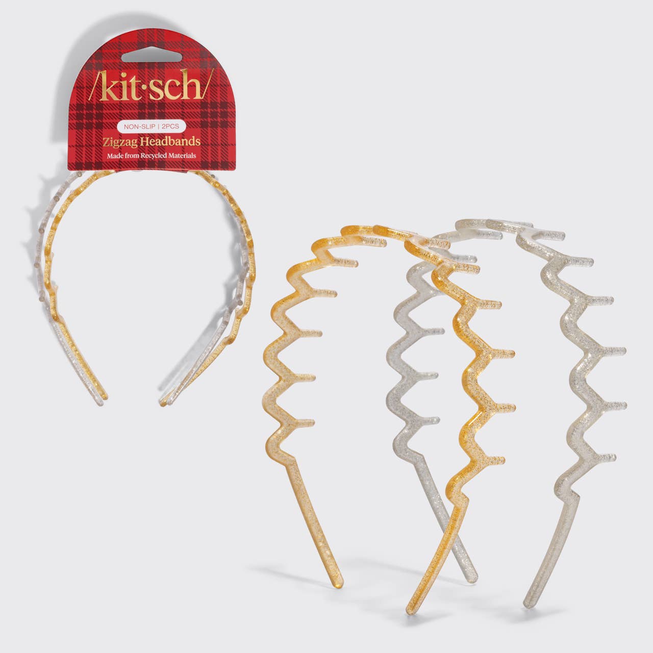 Three zigzag wavy plastic hair bands in gold, silver, and white, shown with a red plaid retail header card labeled kit-sch.
