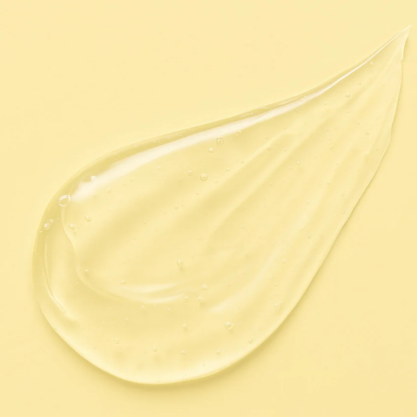 Bali Curls Yellow cream or gel with a droplet on a matching yellow background