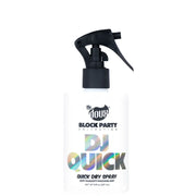 A white spray bottle of 'The Doux Block Party Collection DJ Quick' quick dry spray with a black trigger sprayer, set against a plain white background.