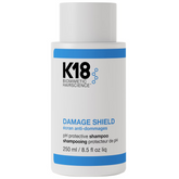 K18 Damage Shield shampoo bottle on a white background