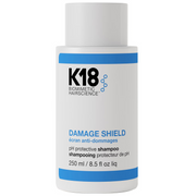 K18 Damage Shield shampoo bottle on a white background