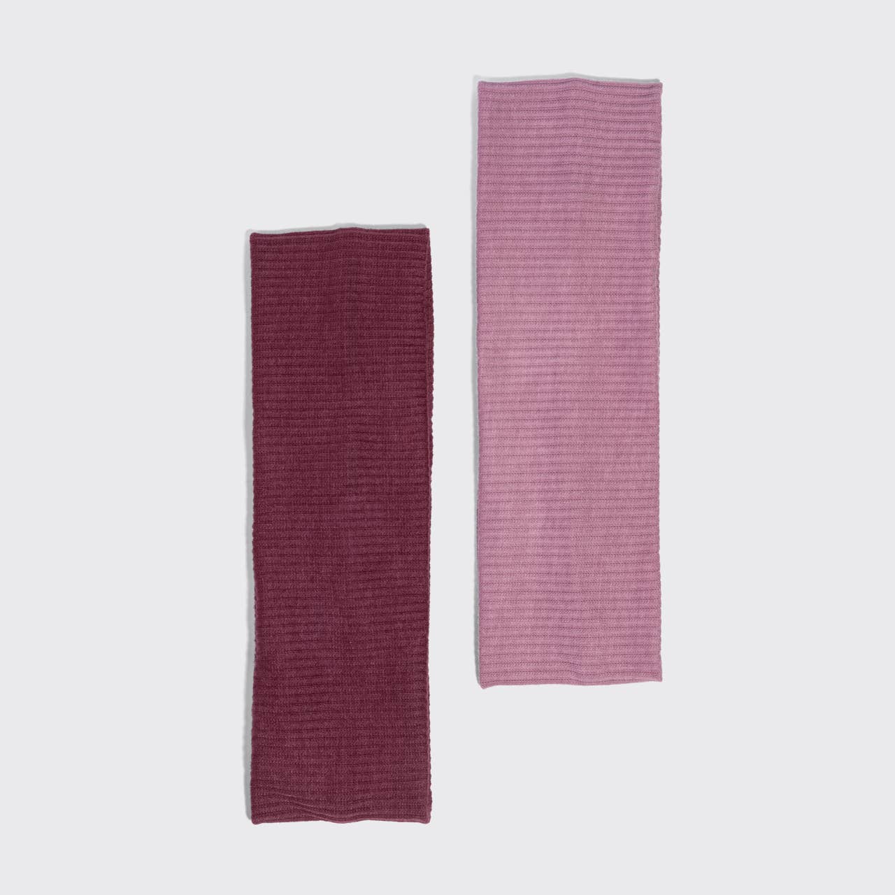 Two rectangular Kitsch ribbed fabric accessories, one in deep burgundy and one in dusty pink, displayed vertically side-by-side on a light gray background.