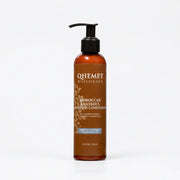 A 7.4 fl oz amber bottle of Qhemet Biologics Moroccan Masqueur Deep Clean Conditioner with a black pump dispenser, shown on a white background with a blue circular 'RINSE-OUT' callout.
