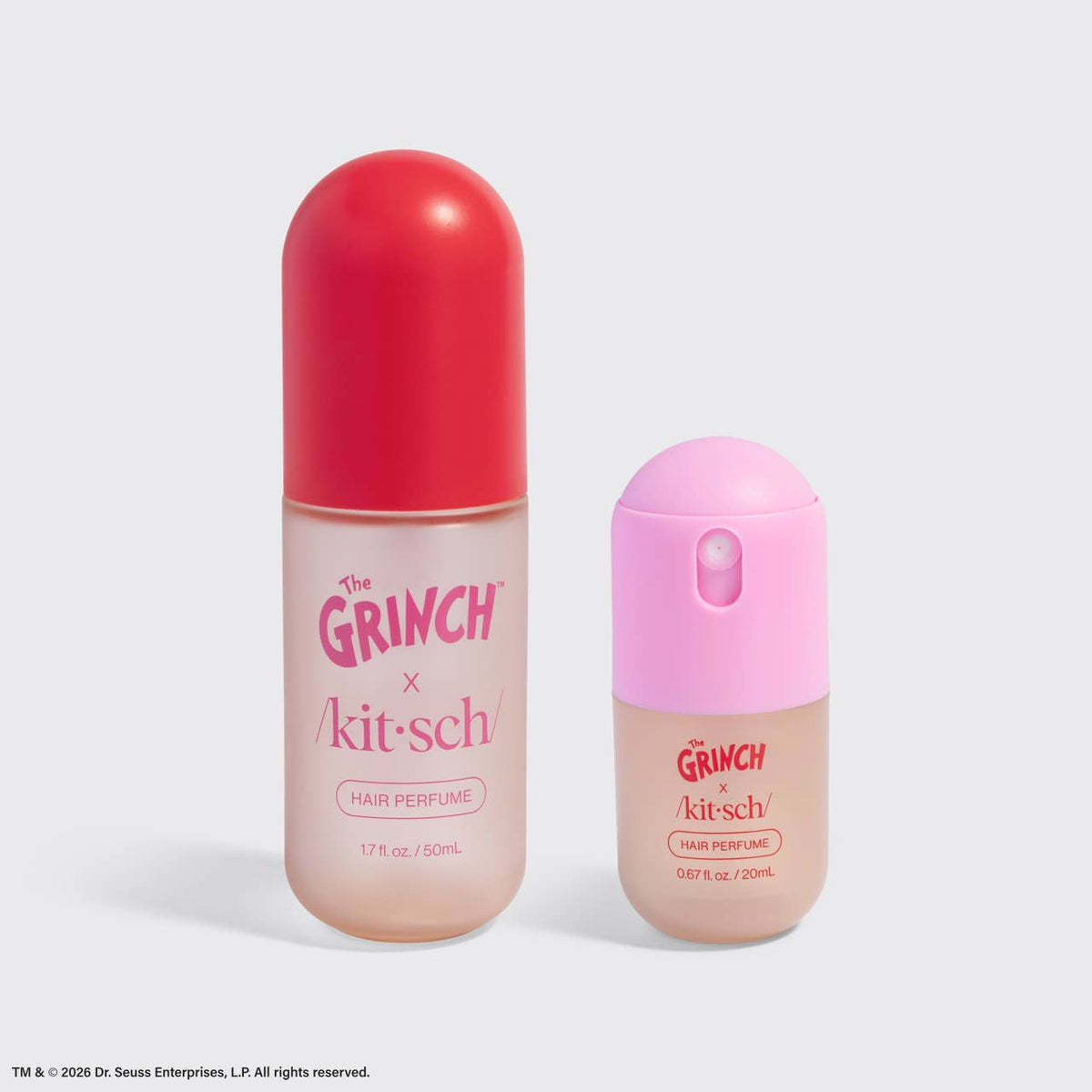 Two Dr. Seuss Enterprises x The Grinch x kitsch Hair Perfume bottles on a light gray background.