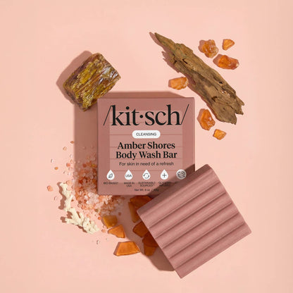 Kitsch Amber Shores body wash bar with packaging on a pink background