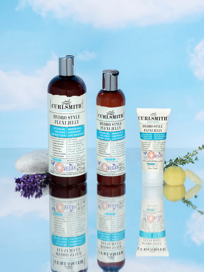 Curlsmith scalp recipe hair care products on a blue background with flowers and stones.