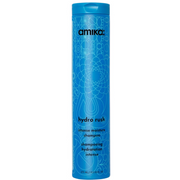 A blue bottle of Amika Hydro Rush Intense Moisture Shampoo with a geometric pattern design.