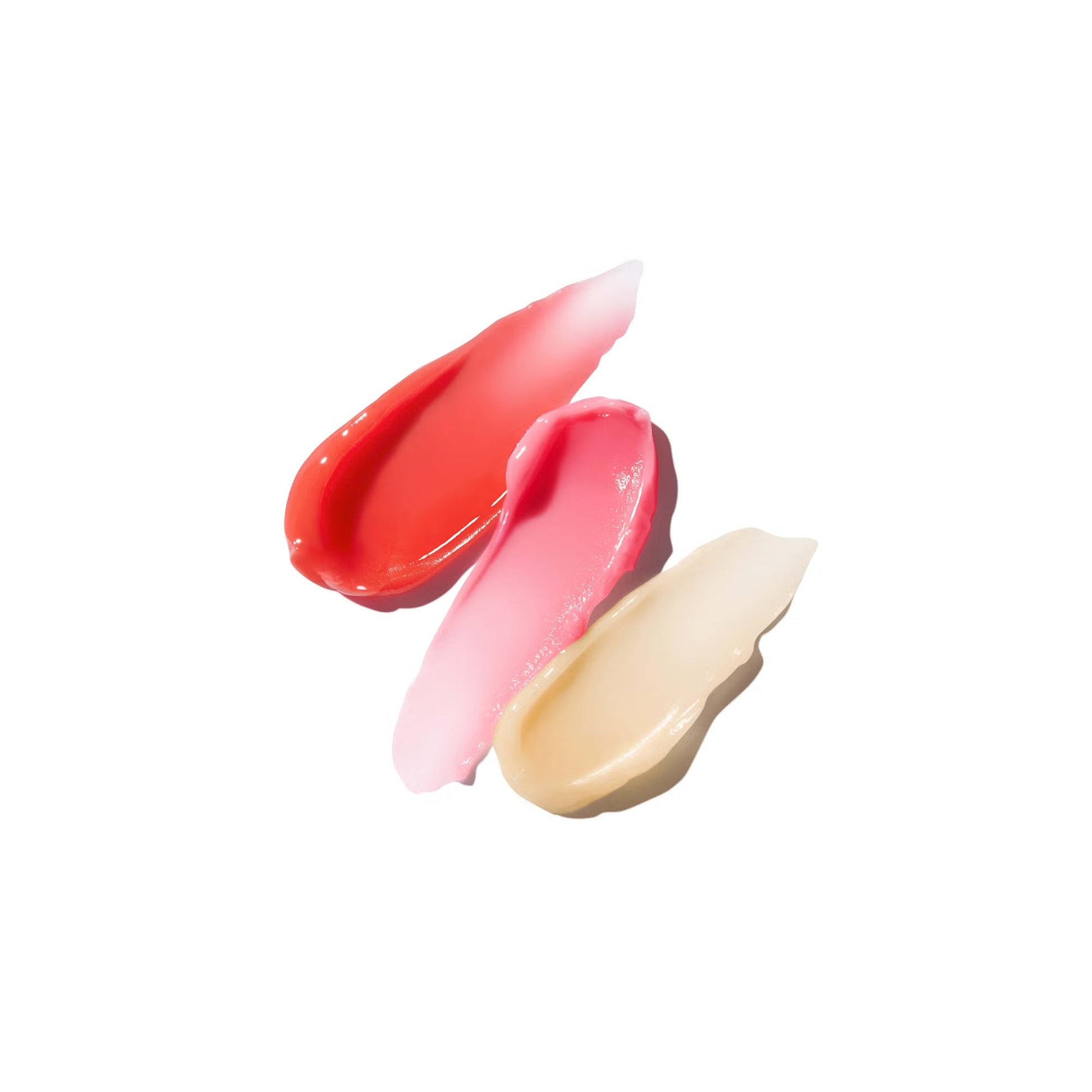 Three swatches of different lip colors on a white background