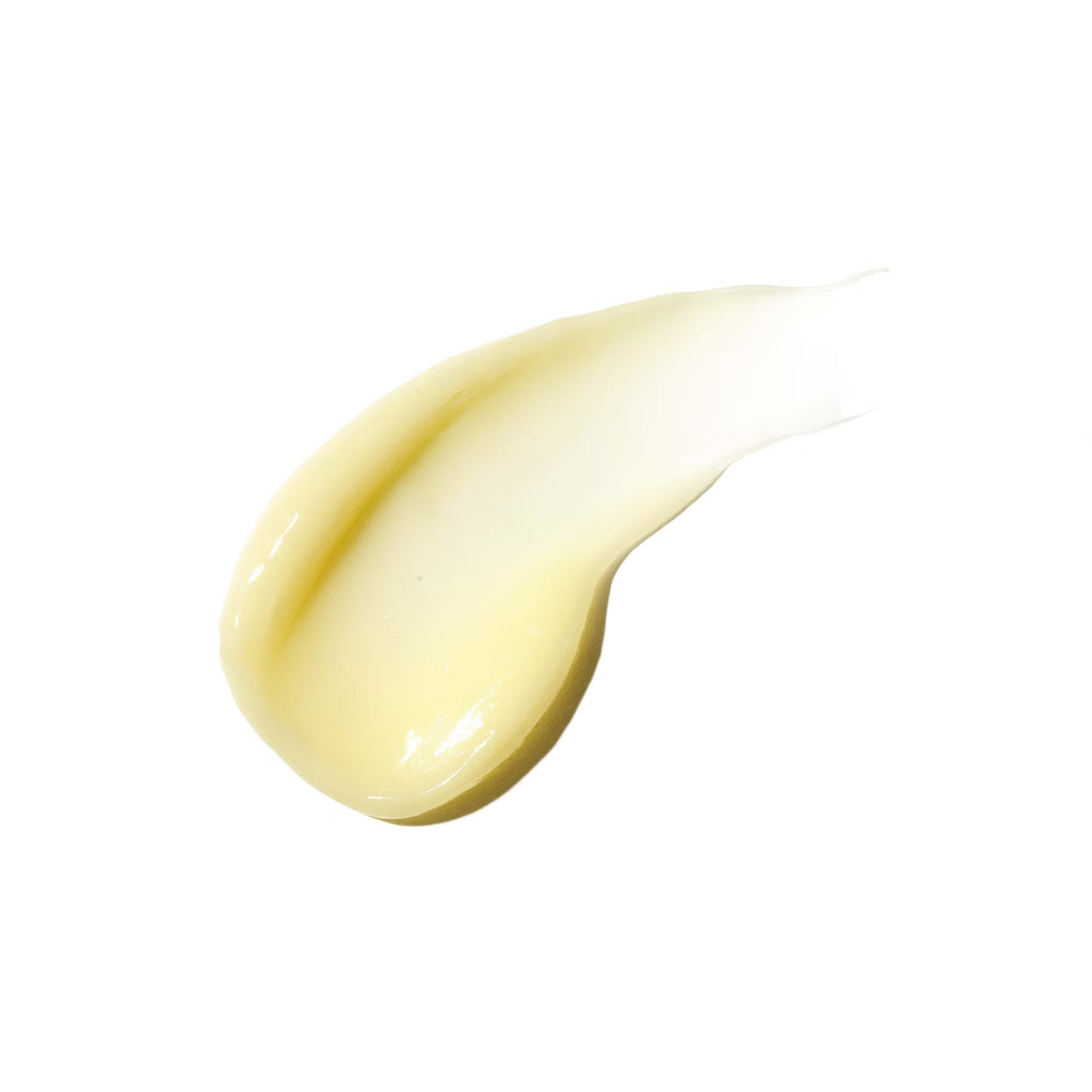 Close-up of a yellow cream smear on a white background