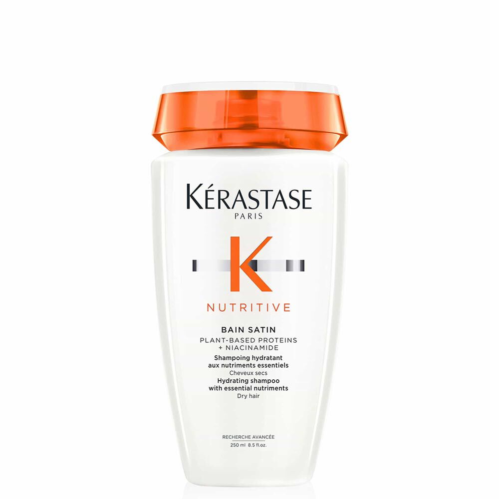 Kérastase Nutritive Bain Satin 250ml white shampoo bottle with orange cap on white, formulated to hydrate and nourish dry hair