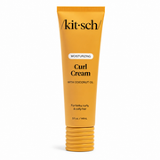 A tube of Kitsch Curl Cream moisturizing hair product in a bright yellow-orange color, featuring black text and a ribbed screw cap, set against a plain white background.