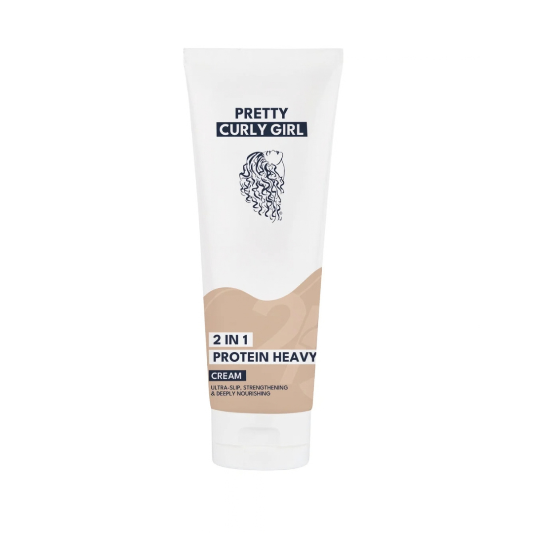 A white squeeze tube of Pretty Curly Girl Protein Heavy Cream on a solid white background.