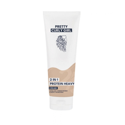 A white squeeze tube of Pretty Curly Girl Protein Heavy Cream on a solid white background.