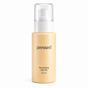 pressed nourishing hair oil 50ml pump bottle with clear cap on a white background