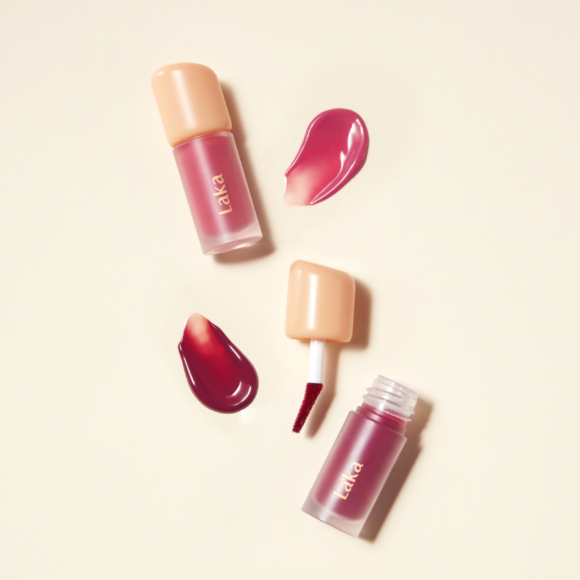 Laka Lip tint products with applicator on a beige background