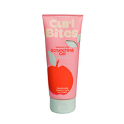 A tube of Curl Bites Scrunching Gel with a pink background, featuring an image of an apple and branding details.